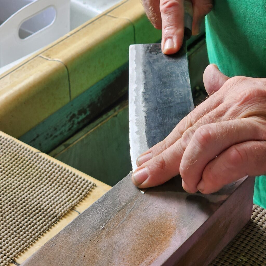 knife sharpening on whetstone